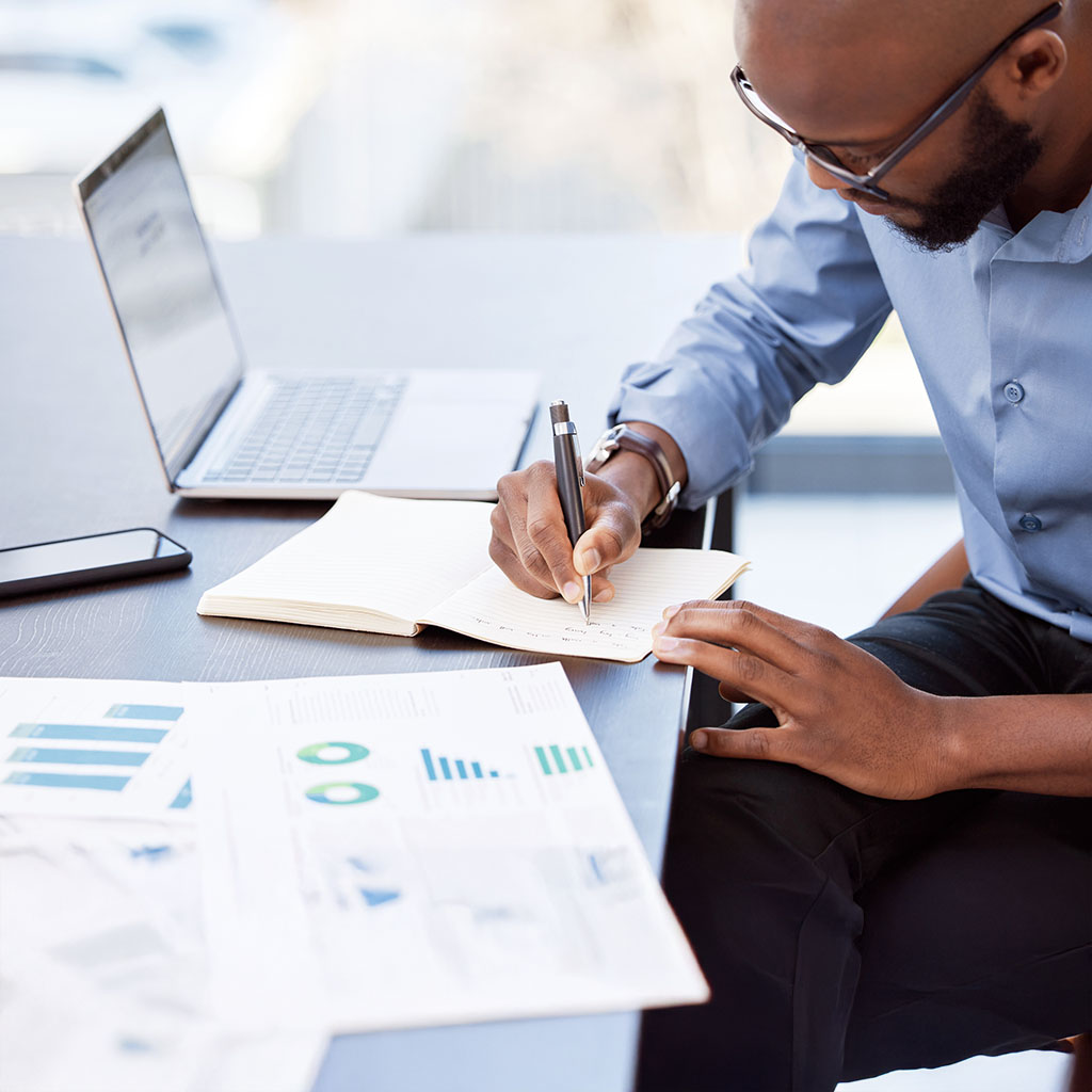 A Best Consultants adviser reviewing a client's financial reports